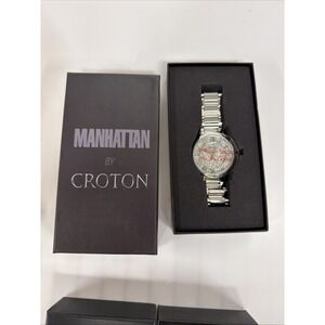 Manhattan by Croton wristwatch features a silver-tone metal band